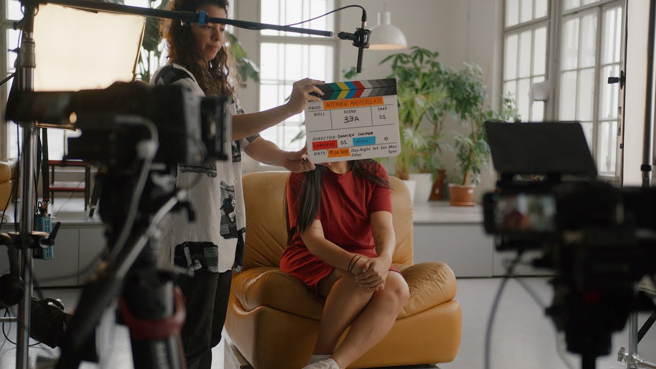 The behind the scenes of a business owner being interviewed.